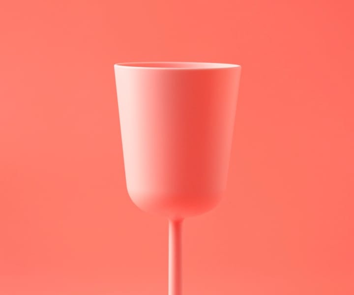 A pink cup on a pink background.